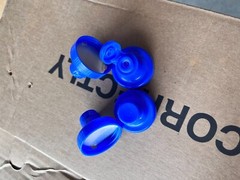 Aptar-38-400 Blue Flip Top Tab Caps with valve. Quantity 1200 per box